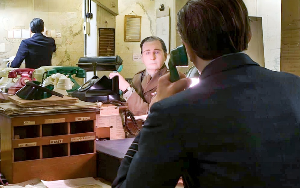 Wartime desk with vintage telephones inside the Churchill War Rooms